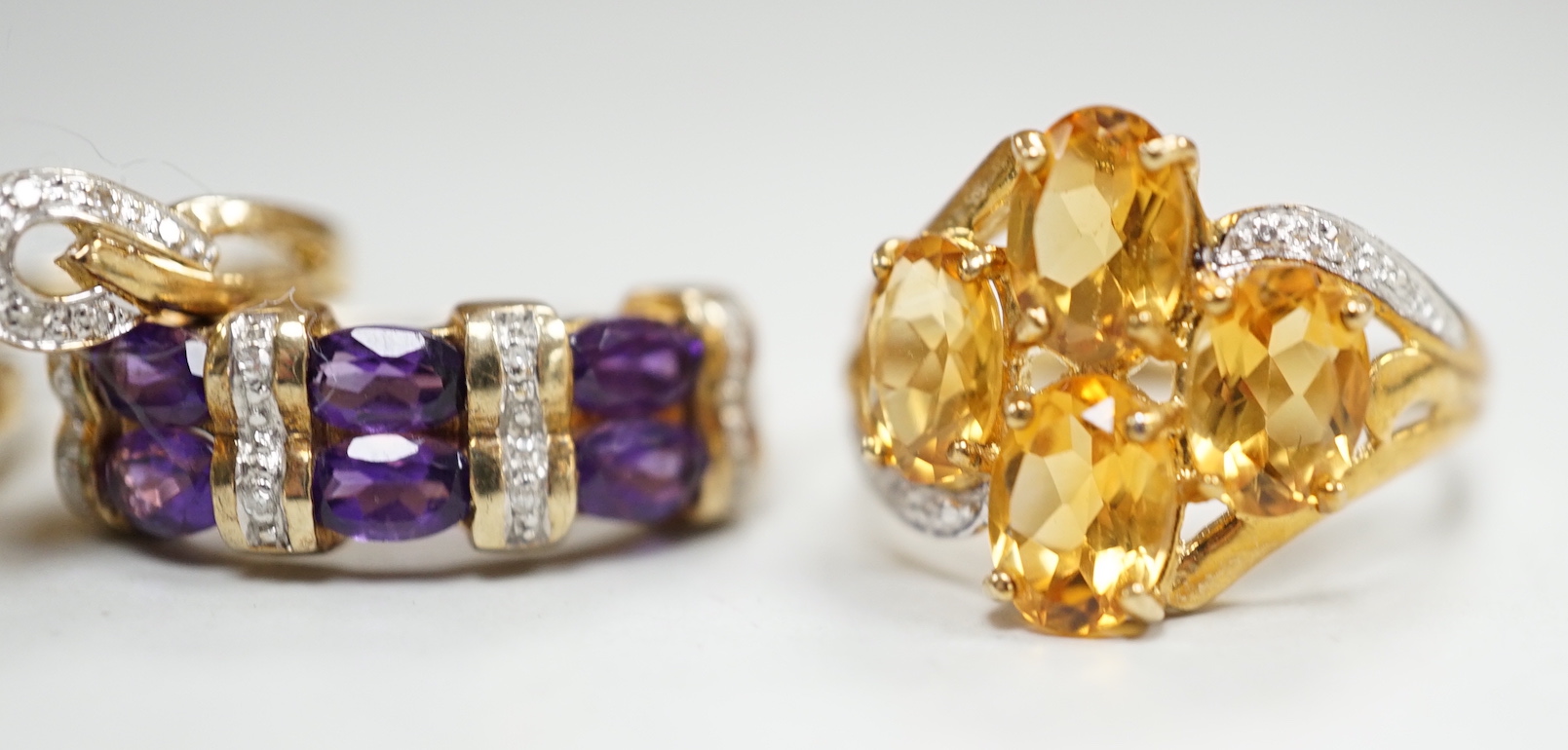 Five assorted modern 9ct gold and gem set dress rings, including citrine and diamond and amethyst and diamond, gross weight 14.8 grams.